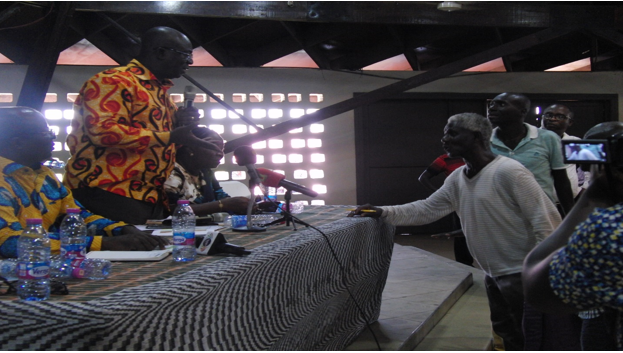 Nana Agyenim Boateng, Amoamanhene, answering a question from one of the traders